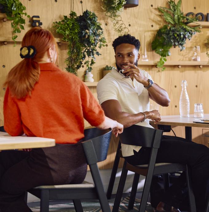 Man and woman chatting in coworking space