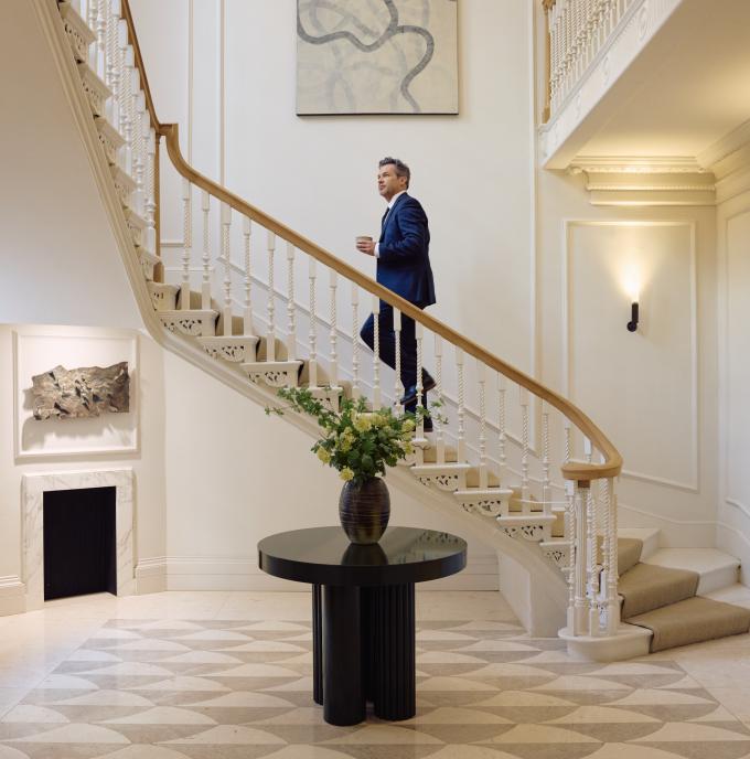 Man walking up staircase